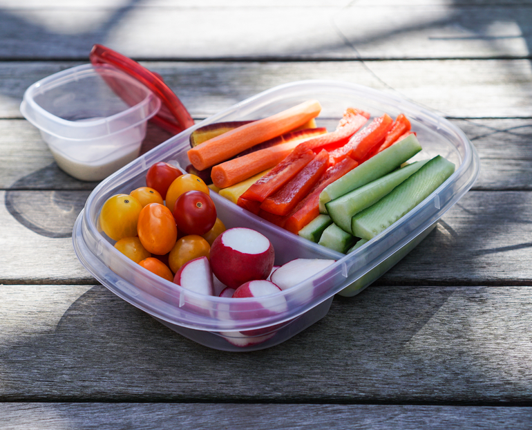 Plastic container/lunch box with vegetables, crudités, healthy eating concept, selective focus